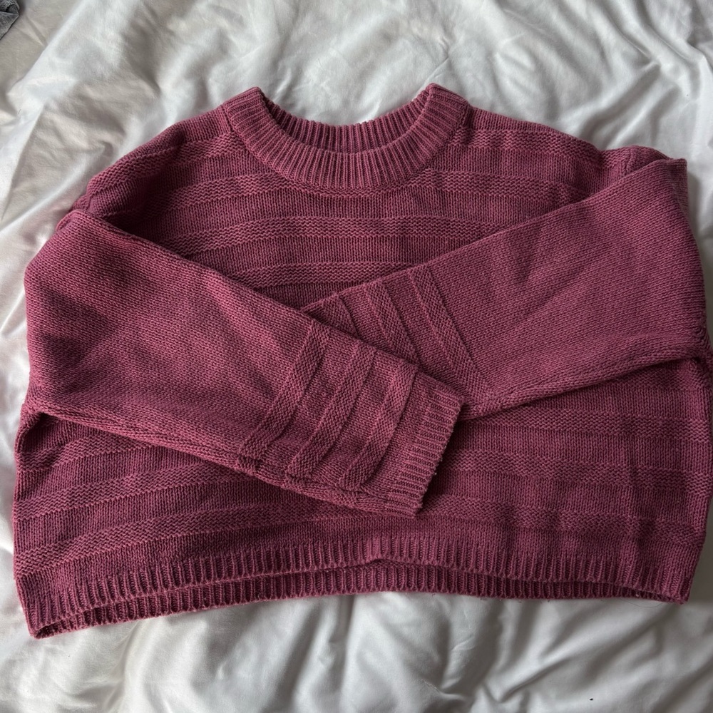 Cropped pink cable knit sweater